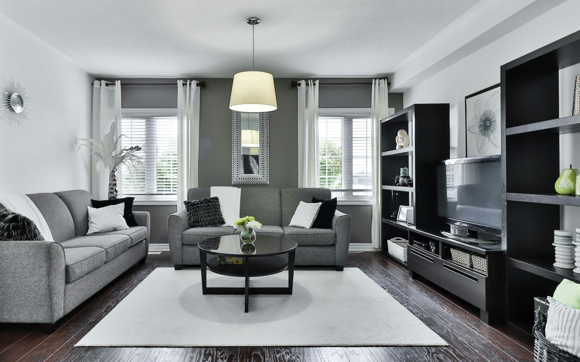 Open living space with the planted court beyond tall sliding panels
