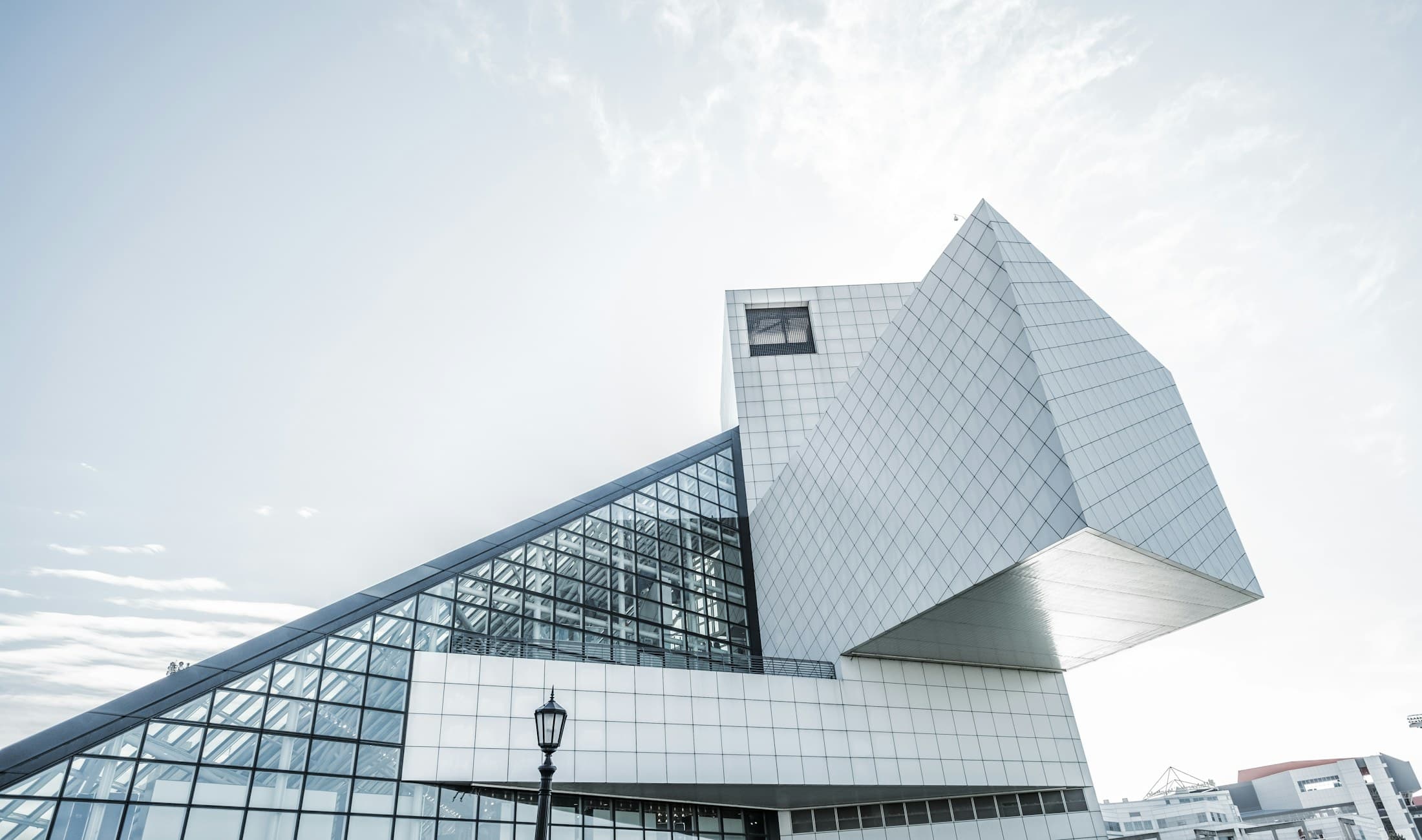 White architectural volume with a deep shadowed void under a strong sky